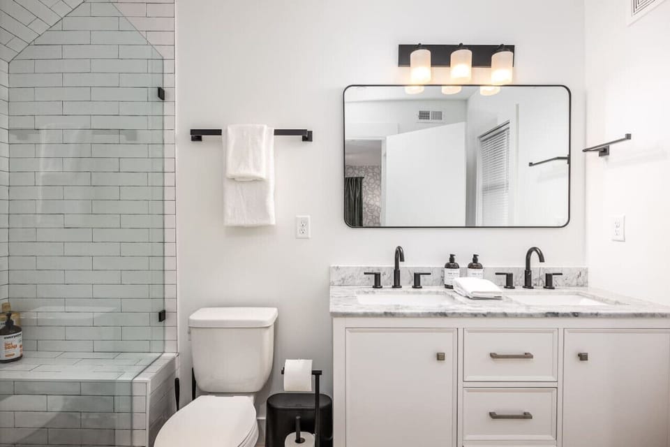 Bathroom #1 with a large standing shower attached to bedroom #1. We provide you with all bathroom necessities like towels, shampoo, conditioner, and body wash.