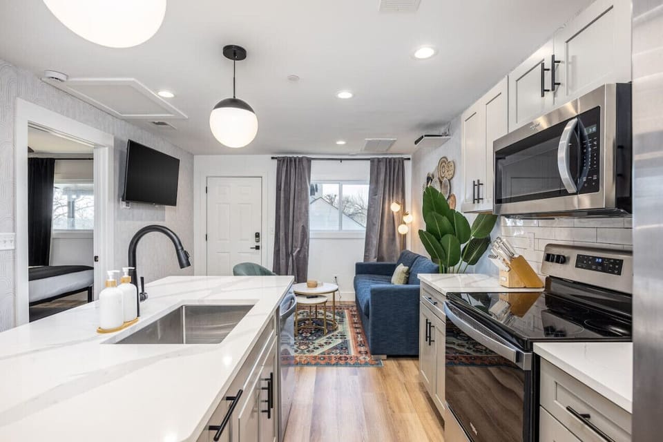 Bright, updated kitchen with all the appliances & utensils you'd need to enjoy a meal at home.
