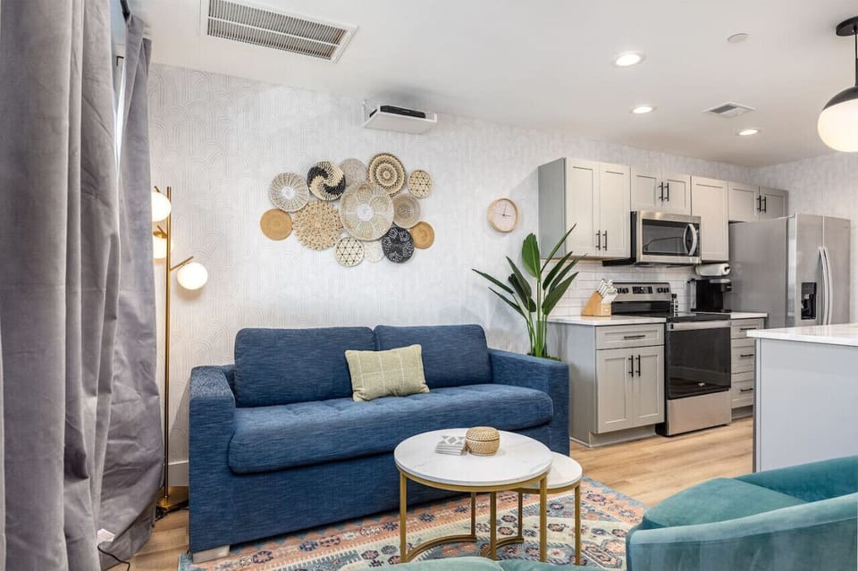 Unwind in the living room with a Smart TV, pull-out couch, and room-darkening shades.