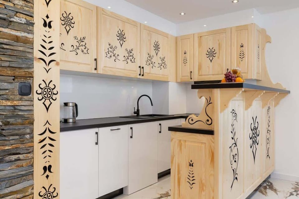Fully equipped kitchenette with induction cooktop.