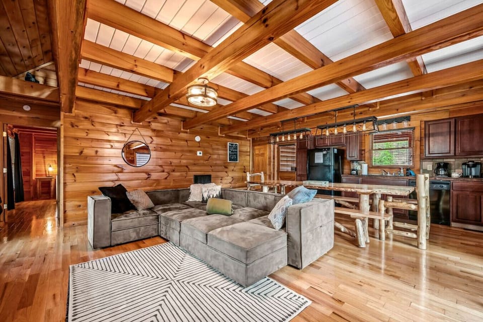 The living room is conveniently located near the kitchen along with a formal dining table.