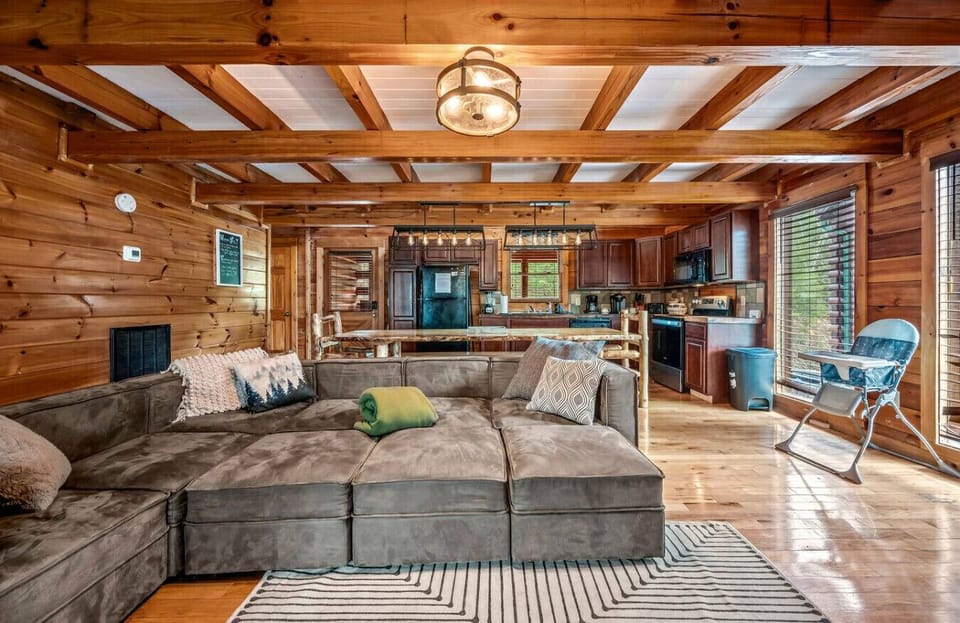 Convenient open floorplan with large windows and wood beam ceilings.