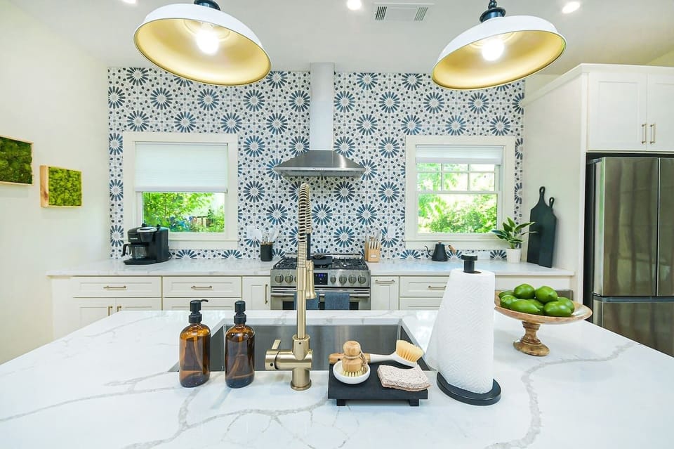 Modern cooking appliances and spacious quartz countertops, the kitchen has it all!
