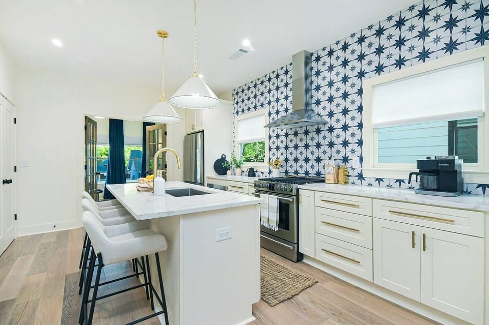 The fully equipped kitchen with quartz countertops is ready for your MasterChef skills.