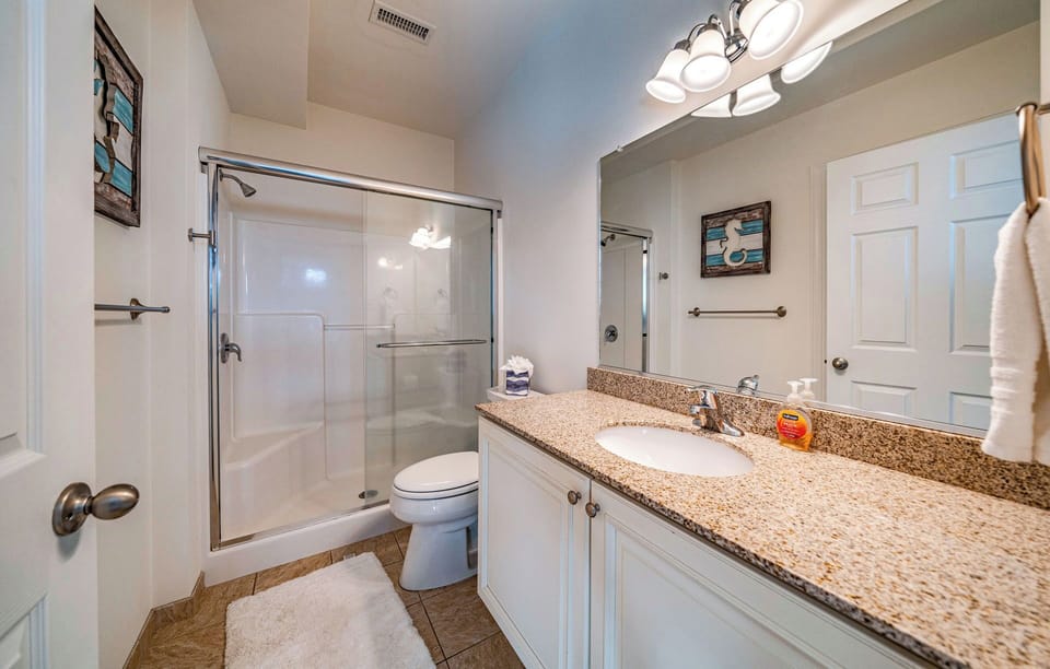 En-suite bathroon with double vanity and granite tops