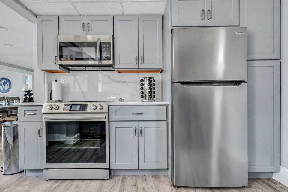 Electric oven and stove. Built in microwave.  Brand new SS Appliances