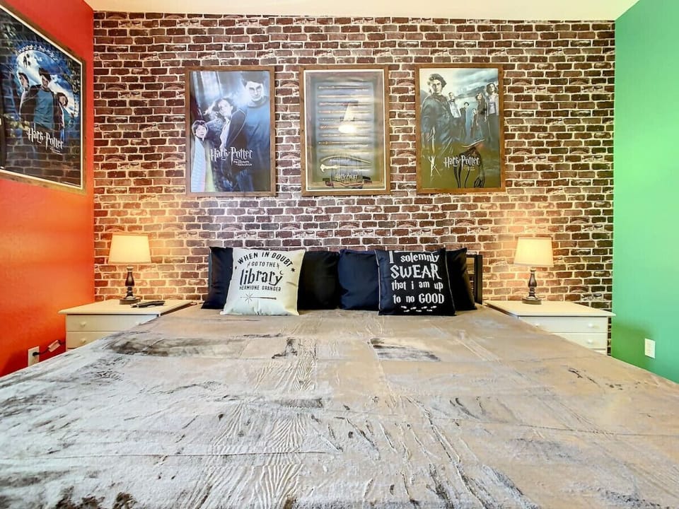 Savor the detailed Harry Potter wall frames in this king-sized bedroom