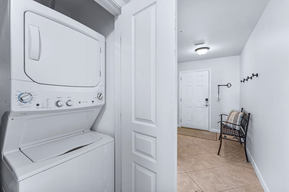 Hallway with washer and dryer