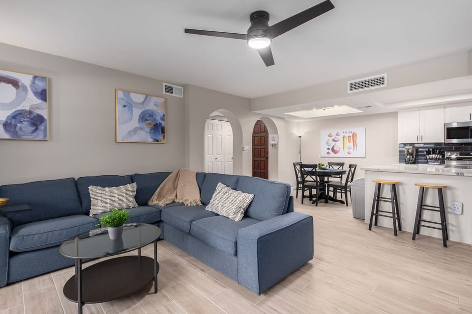 Relax in this living room on the comfortable plush sofa