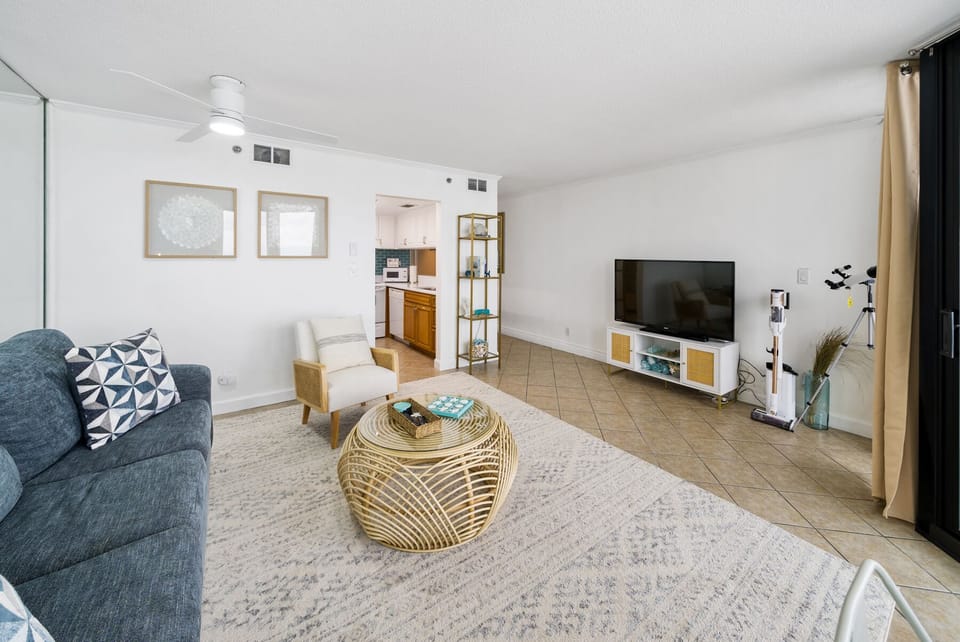 Modern, bright living room with a sofa bed for extra guests and TV with cable.