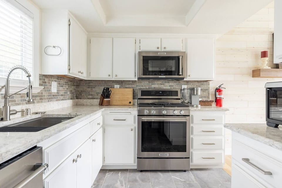 Fully furnished kitchen. Ready to make your culinary and hosting dreams come true!  Includes pots, pans, a variety of spices and condiments, Ninja blender, baking sheets, cooking utensils, cooking knives, an Instant Pot, and more!