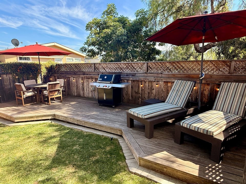 Outdoor deck includes BBQ with tools, 2 chaise lounge chairs, a dining table with 4 chairs, and 2 camping rocker chairs (stored in garage).