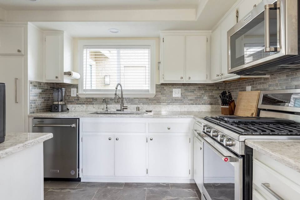 Fully furnished kitchen. Ready to make your culinary and hosting dreams come true!  Includes pots, pans, a variety of spices and condiments, Ninja blender, baking sheets, cooking utensils, cooking knives, an Instant Pot, and more!