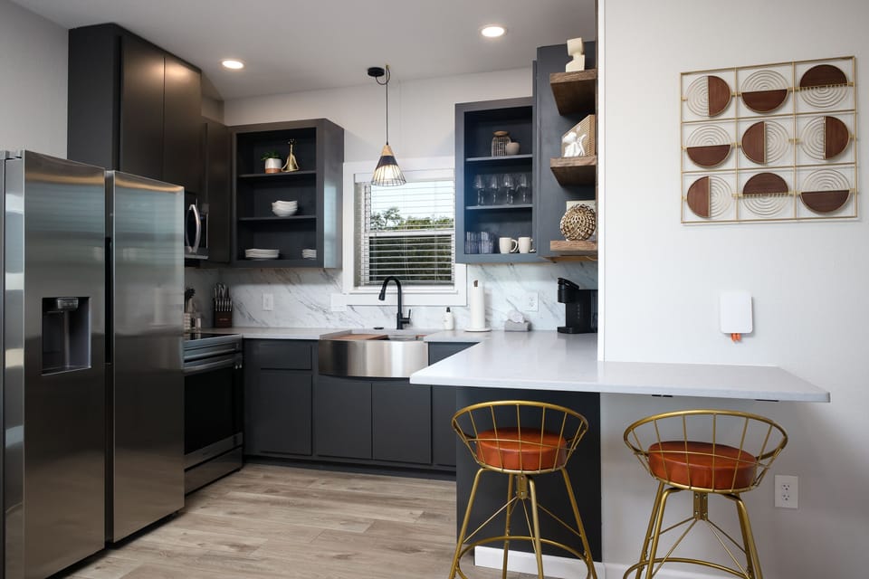 Another view of the full size kitchen ready for any meal you’d like to prepare. Stocked with coffee and all the basic cooking needs.