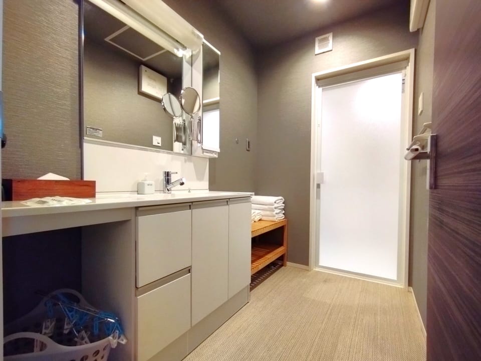 Separate tub and shower, free toiletries, hair dryer, slippers