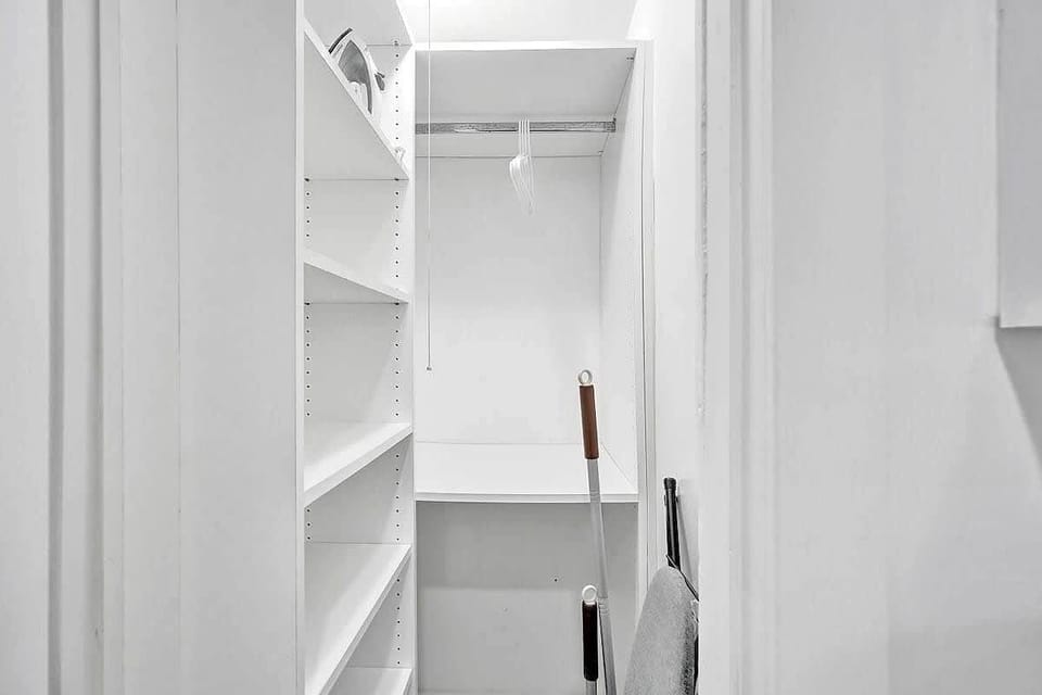 Spacious walk-in closet with shelving