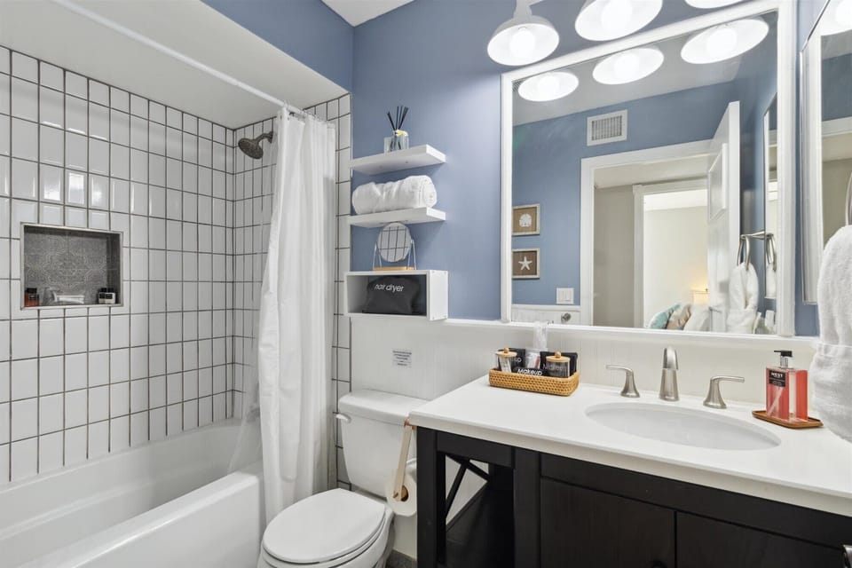 Enjoy the provided amenities like shower essentials, a hair dryer, makeup towels, and more.