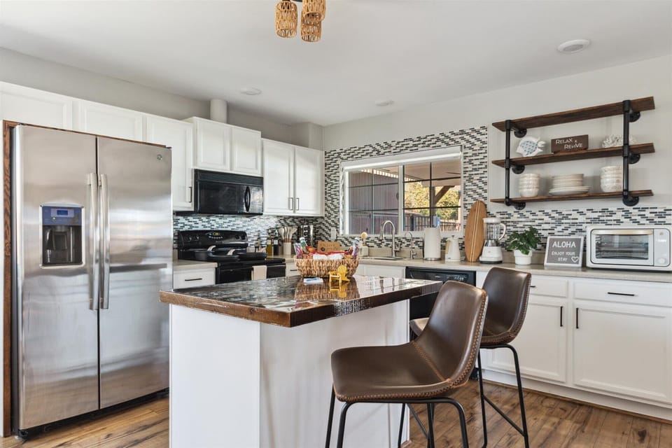 There is additional barstool seating for 2 at the kitchen island.