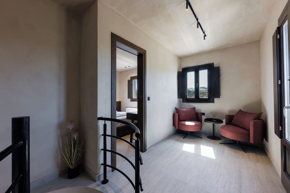 Grand Villa with Outdoor Hot Tub and Private Heated Pool | Living area | 30-cm flat-screen TV with cable channels