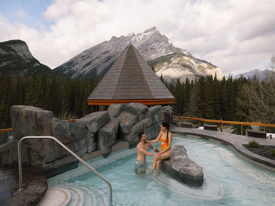 Indulge in a serene mountain experience while soaking in the rooftop hot pool, surrounded by breathtaking views of towering peaks.