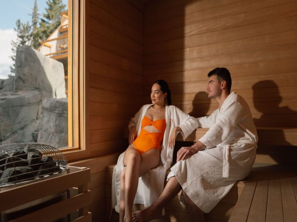 Relax and rejuvenate in a cozy, tranquil sauna, embraced by the warmth of natural wood and soft lighting.