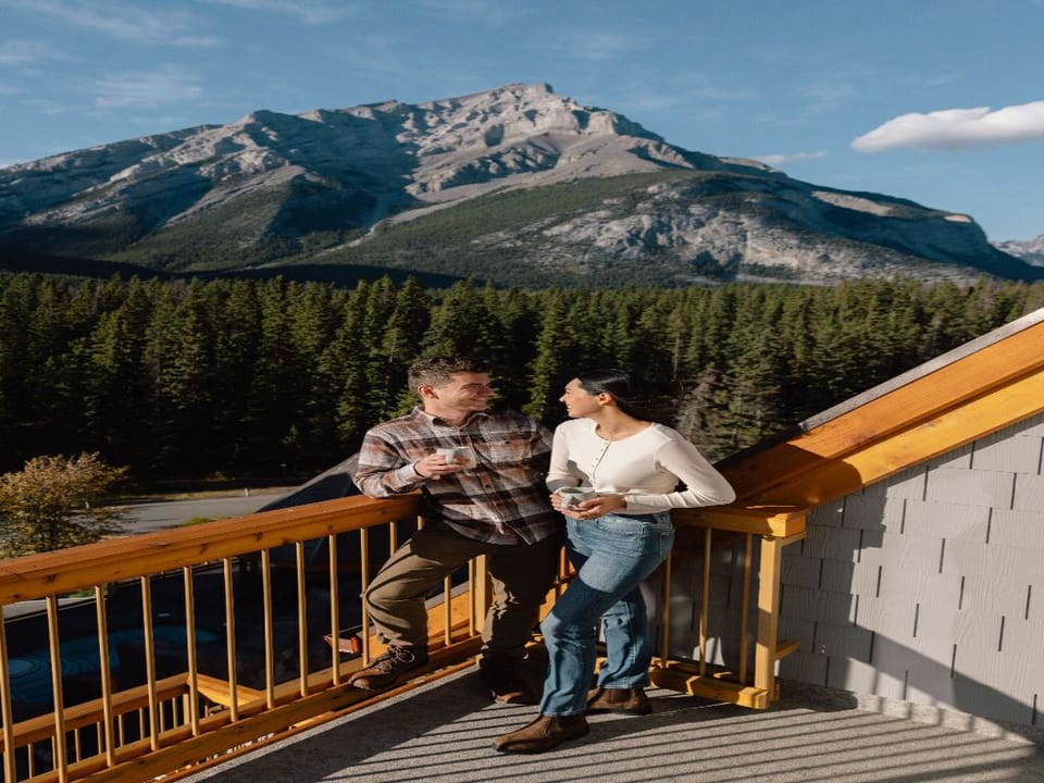 Take in the breathtaking mountain views from a charming outdoor deck, perfect for quiet conversations and peaceful reflections.