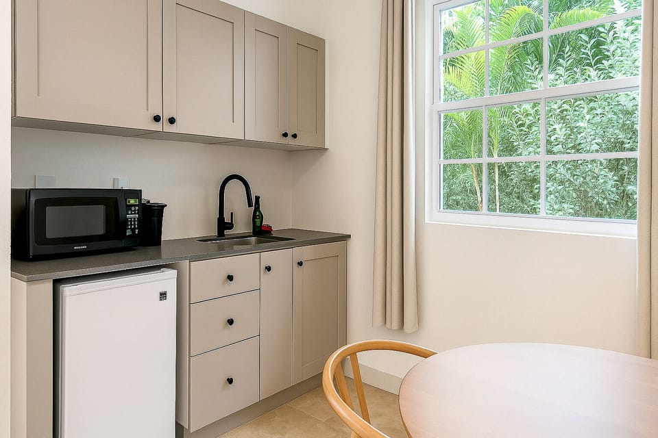 Standard Room, 1 King Bed, Pool View | Private kitchen | Mini-fridge, microwave, coffee/tea maker, highchair