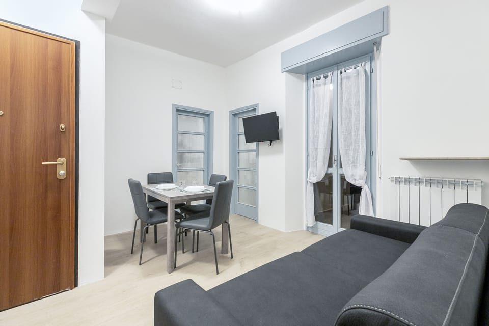Comfort Apartment | Living area | 32-inch flat-screen TV with cable channels
