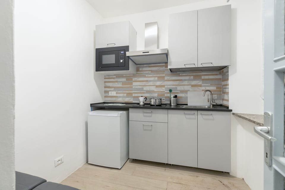 Comfort Apartment | Private kitchen | Microwave, espresso maker, cookware/dishes/utensils