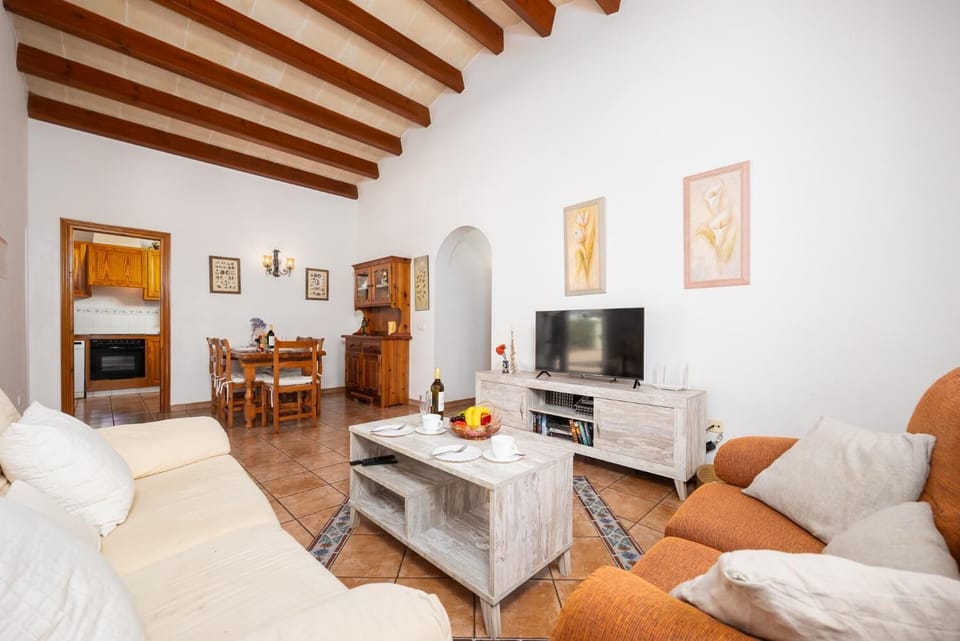 Living room with sofas, dining area, WiFi internet, and satellite TV