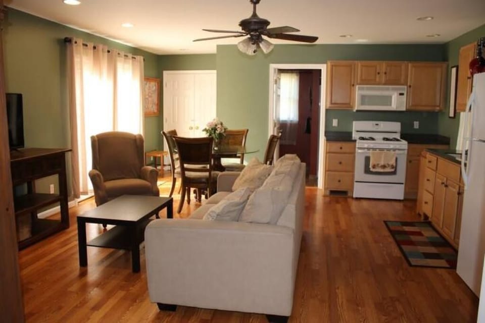 Living, kitchen, dining room combo...bathroom straight ahead, bedroom behind