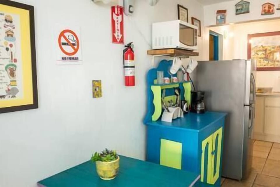 Fully equipped kitchen with small dining area.