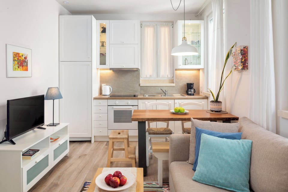 "Experience the essence of Greek hospitality in our thoughtfully designed studio."