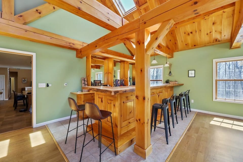 Custom built 15' Maple live edge bar top, with kegerator and tap.