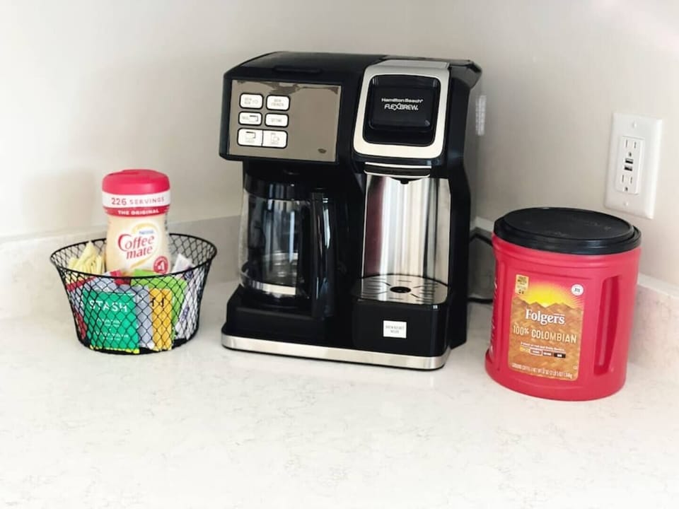 We have a combo drip coffee pot and k-cup machine by Hamilton Beach. We provide a starter pack with coffee, creamer, sweetener, and an assortment of teas.