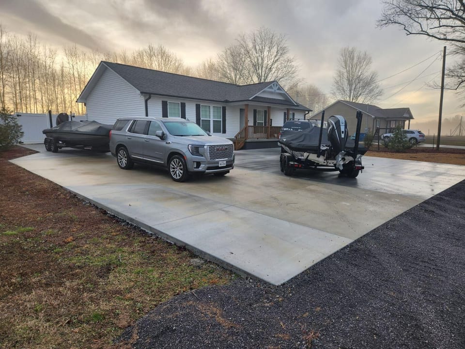We’ve fit 4 boats 4 trucks and 2 cars on the concrete before.