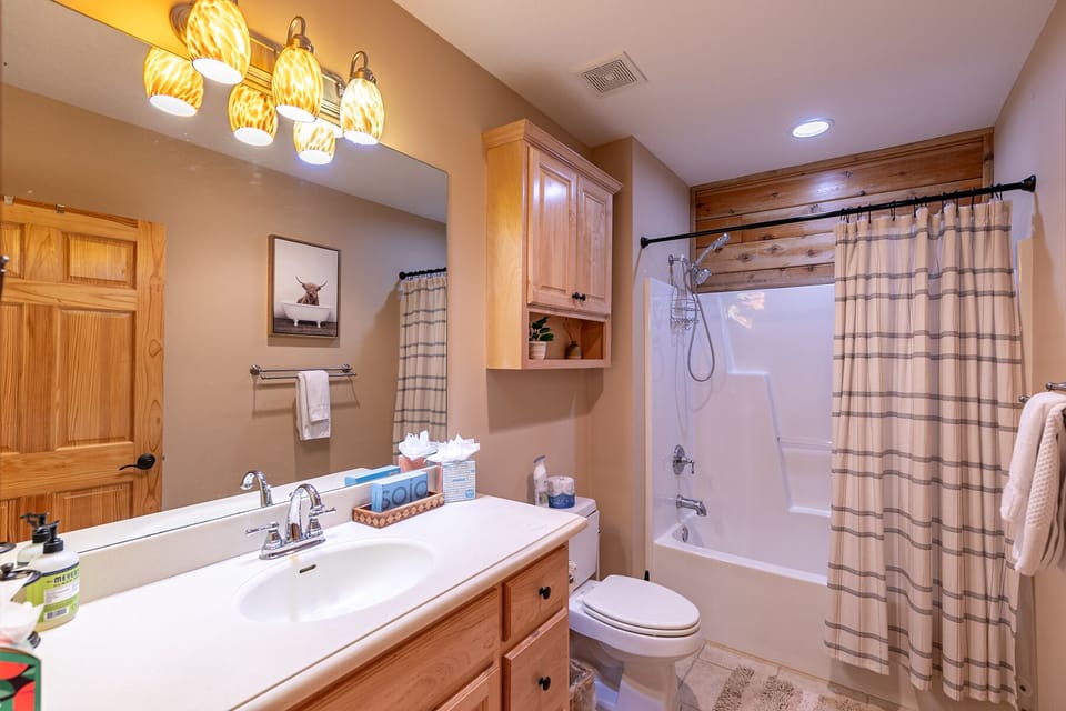 A well-stocked full bath at Whiskey River By The New, ready to refresh after a day in the Blue Ridge Mountains.