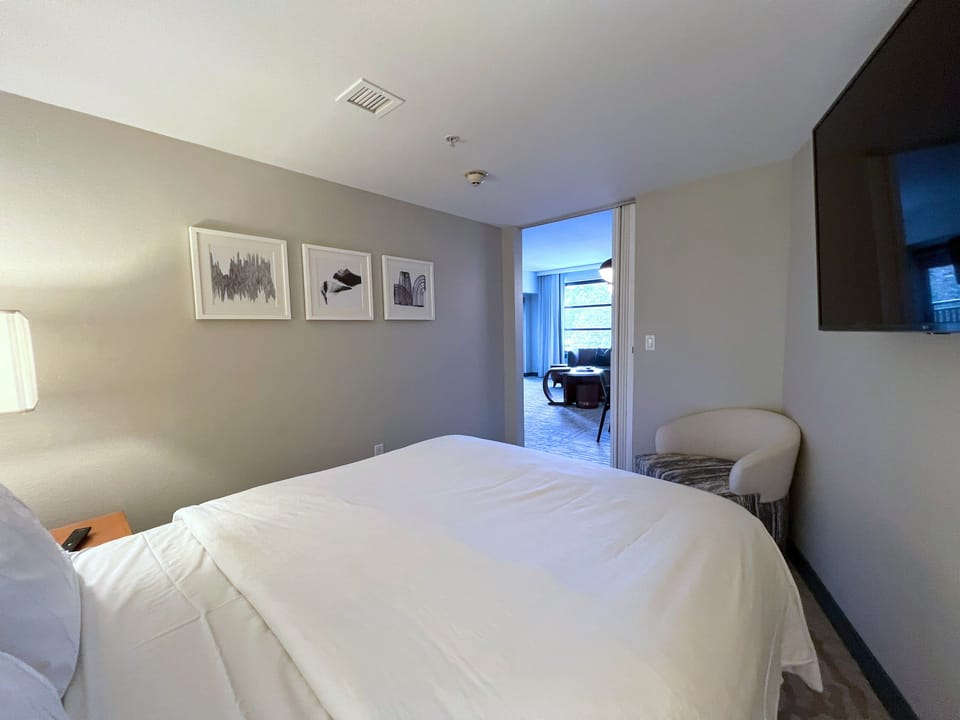 Bedroom 2 located off main living area, with peek-a-boo views from living room window.