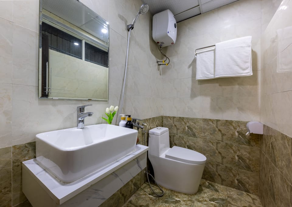 Shower, free toiletries, hair dryer, slippers