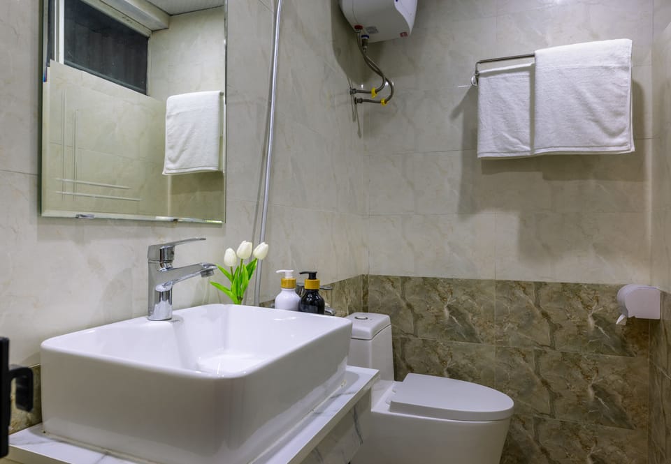 Shower, free toiletries, hair dryer, slippers