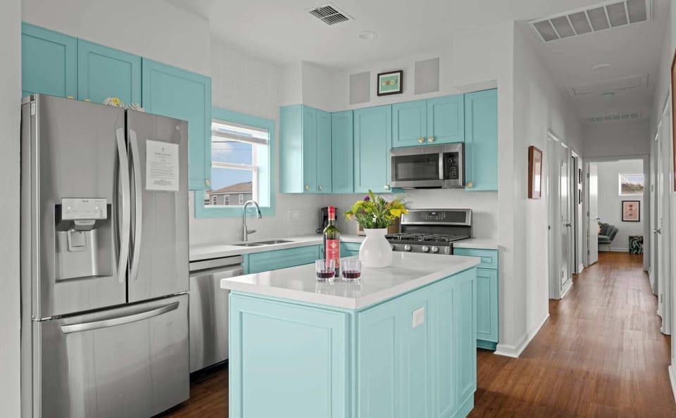 Kitchen — Turquoise Island with Wine & Hallway to Bedrooms