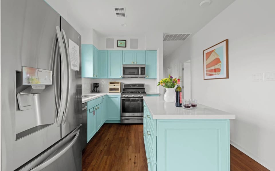 Kitchen — Turquoise Cabinets, White Quartz Counters & Stainless Appliances