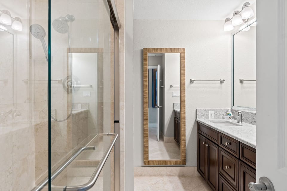 Master bath with walk-in shower, double vanity, and all essentials provided.