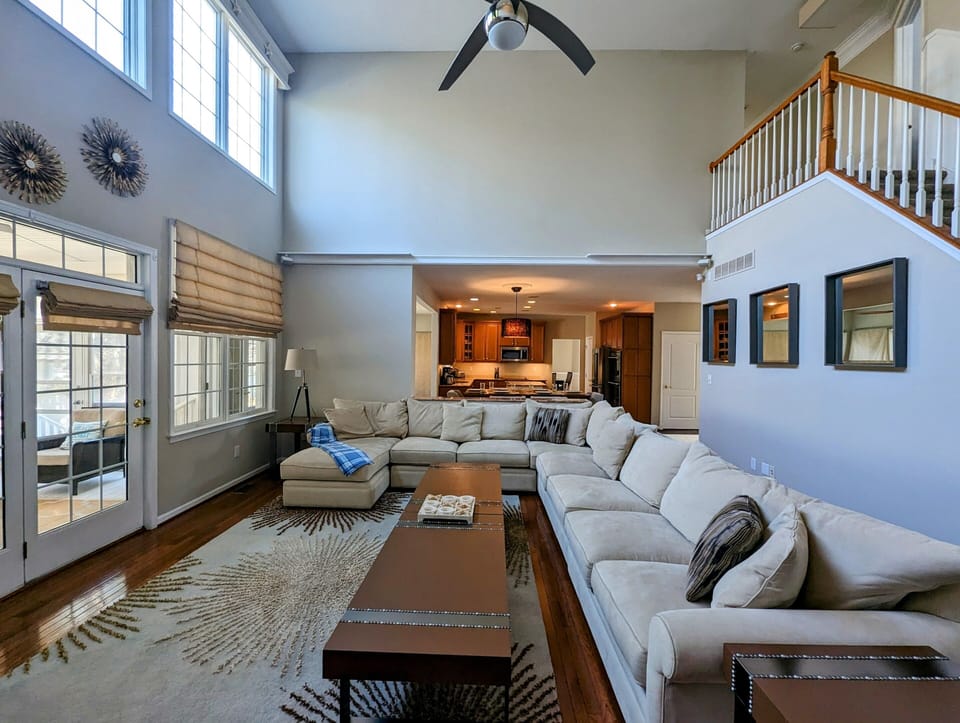 38353 Virginia Drive - Bethany Lakes - family area - A focused look at the living space featuring high ceilings, elegant window treatments, and high-end finishes that create a sophisticated yet comfortable atmosphere.