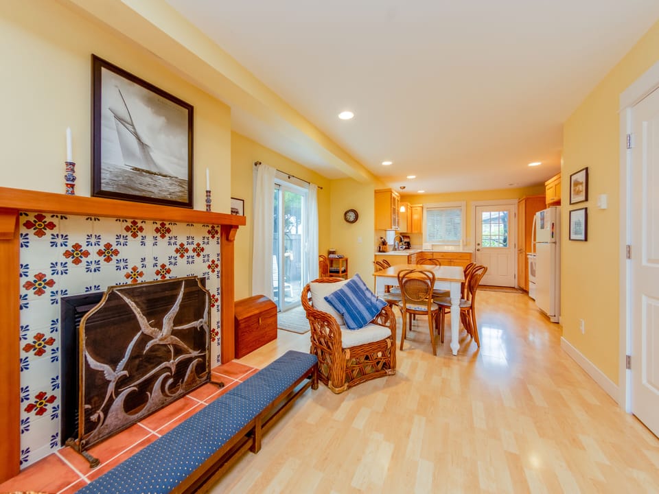 Living room with gas fireplace, streaming TV, DVD player.
