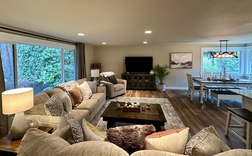 Living Room has large flat screen TV & adjoins the kitchen & dining rooms.
