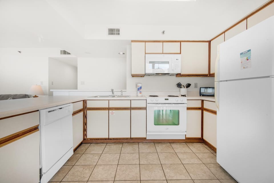 Condo, Multiple Beds (Tristan Towers unit 10A) | Private kitchen | Oven, toaster, paper towels