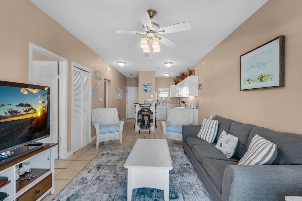 Condo, Multiple Beds (Baywatch F8) | Living area | TV