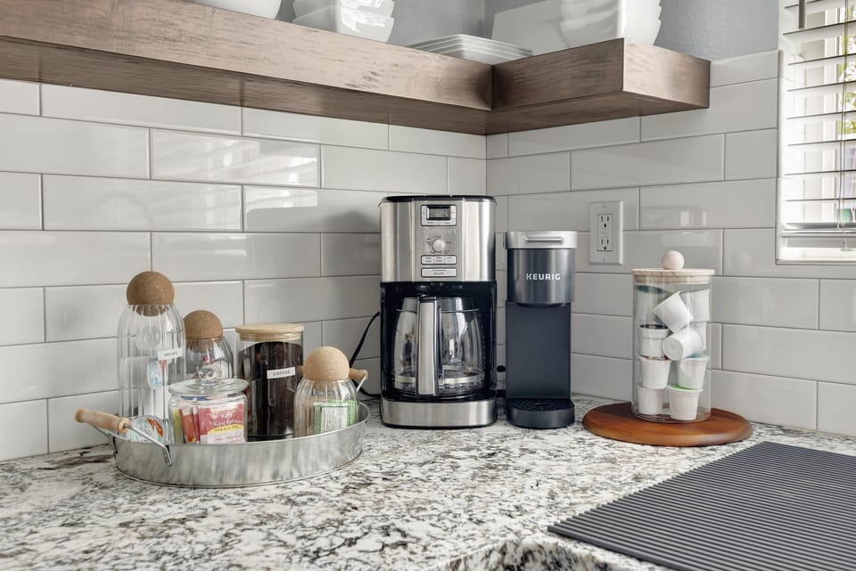 Delux coffee station provided with complimentary, coffee, tea, sugar and creamer.