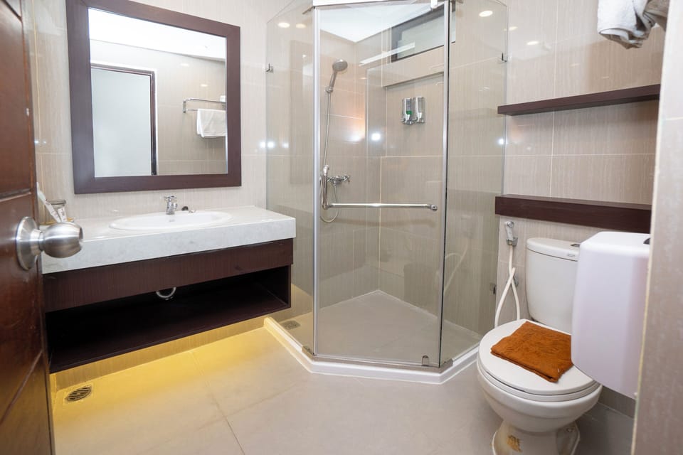 Shower, free toiletries, slippers, towels